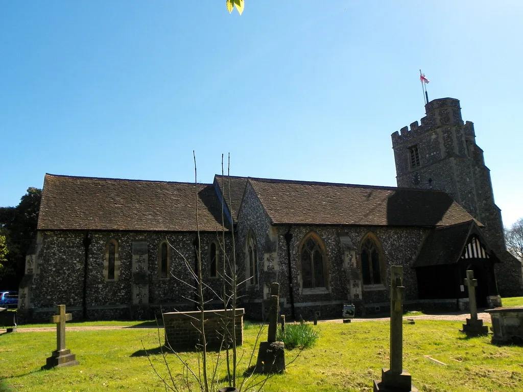 St James's Church, Bushey. The clock face sits on the bell tower on the right
